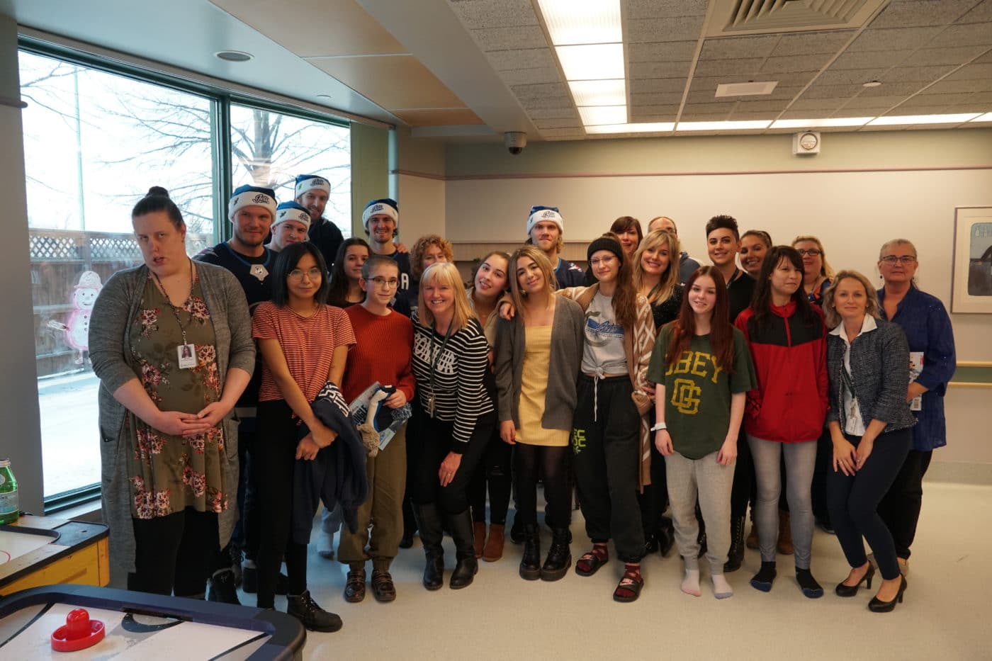 Staff and Youth patients at HSC's Psychealth Centre with some of the Winnipeg Jets.