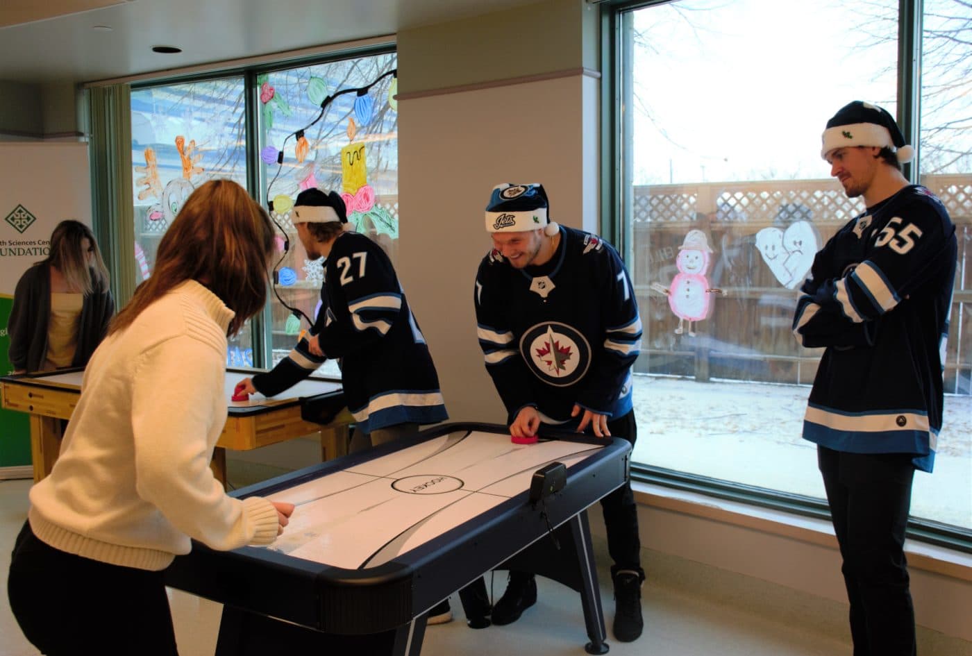 Dmitry Kulikov, a youth patient, and Mark Scheifele