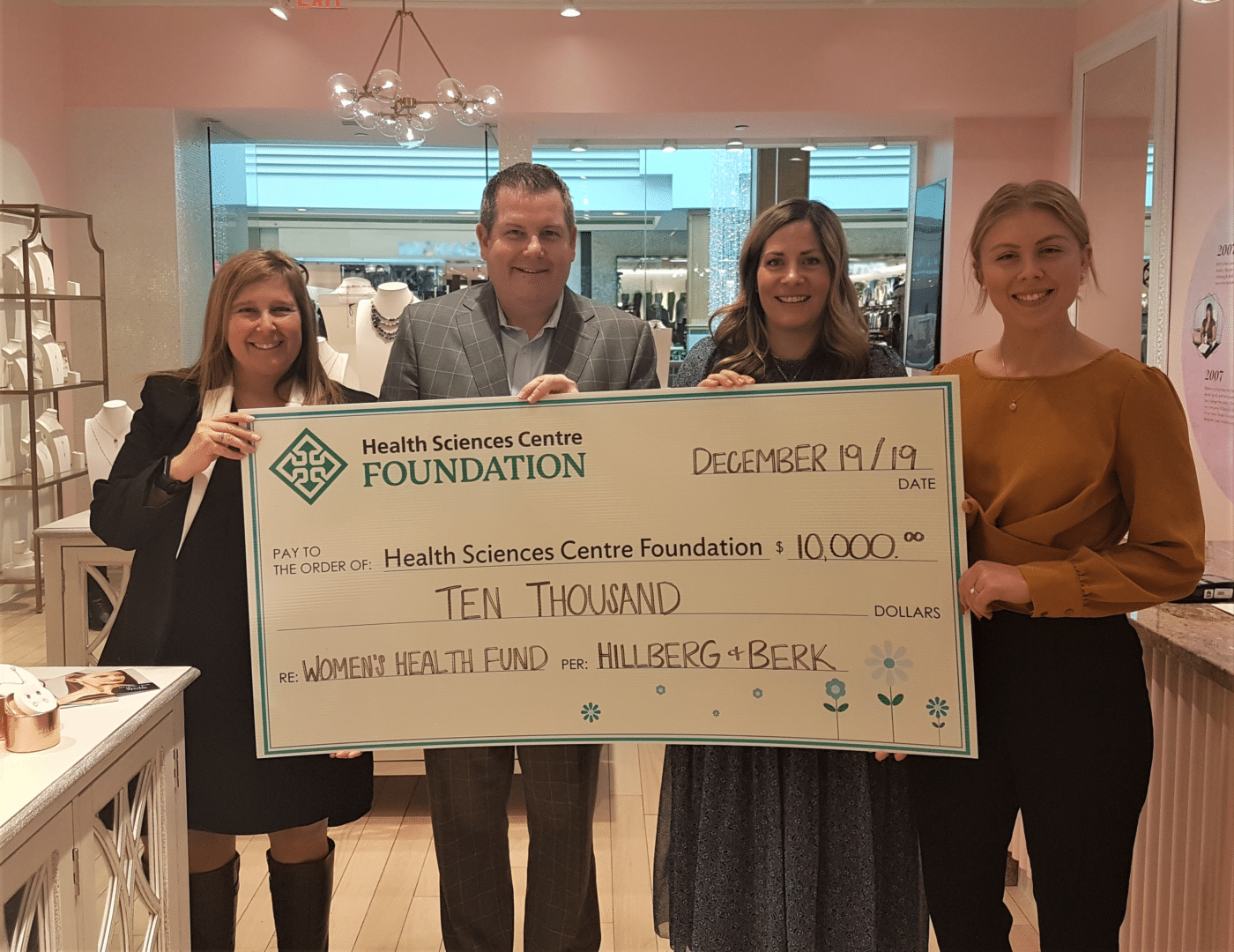 Monique Levesque-Pharoah and Jonathon Lyon accepting a cheque from Rachel Mielke Haley Bolen