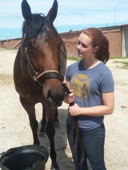 Rebecca Fentum-Jones tending to a horse