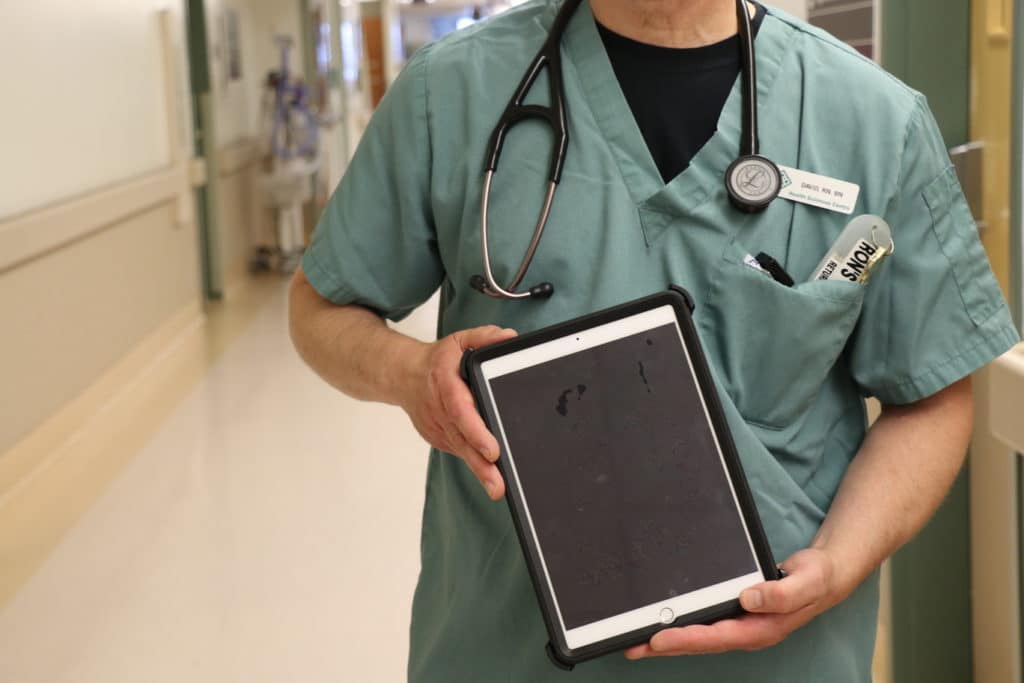 HSC Nurse holding new iPad.