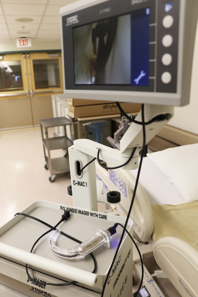 a video-assisted laryngoscope in a hospital hallway.jpg
