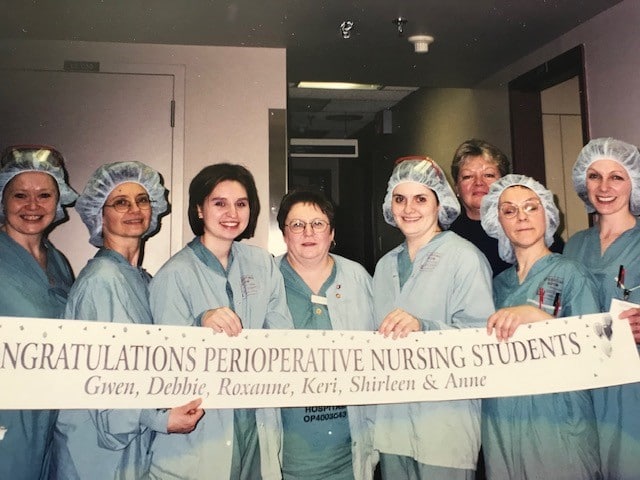 Carole Rickey with graduating class of perioperative nursing students.