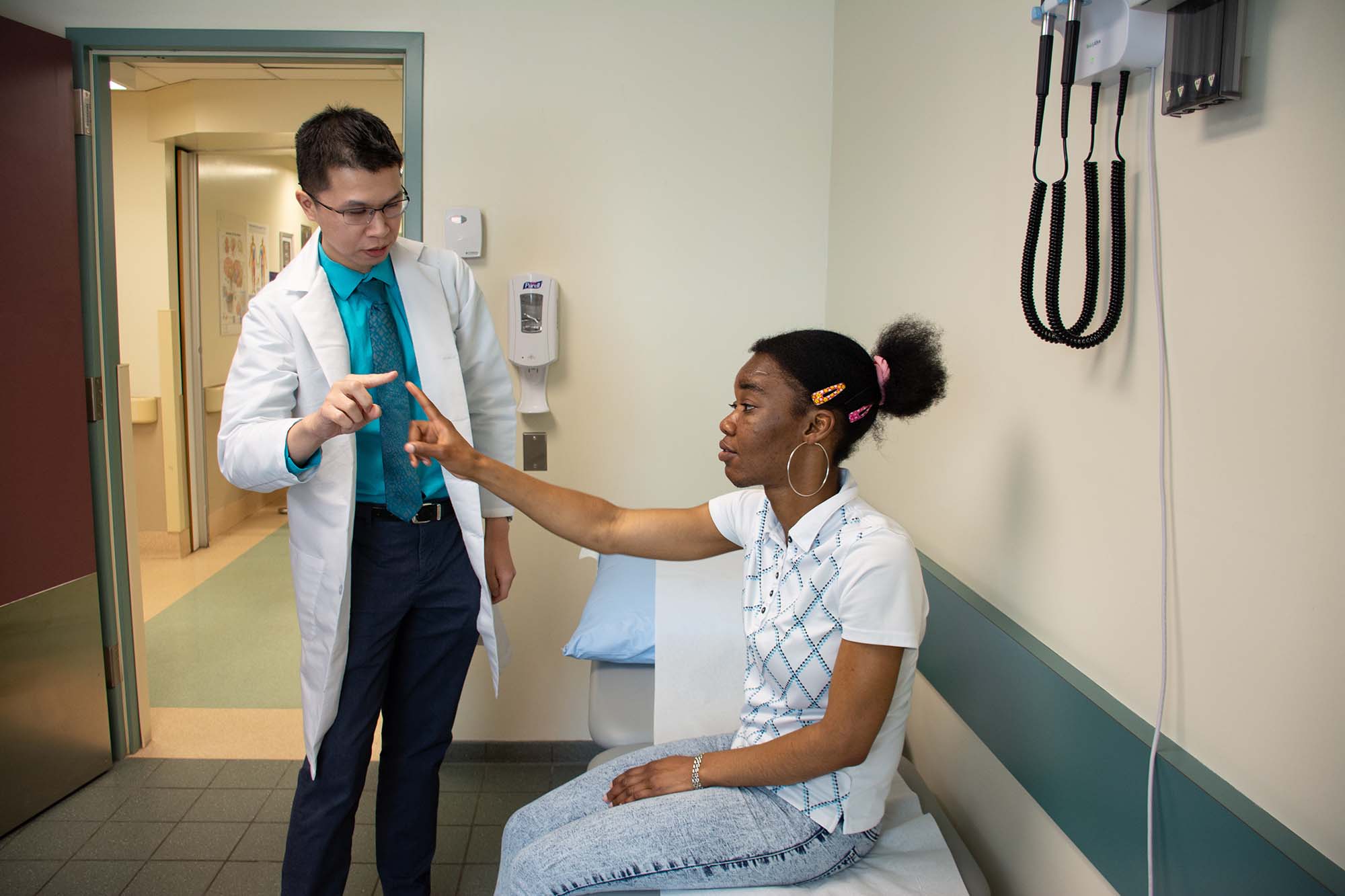 Dr. Marcus Ng with patient Gertrude.