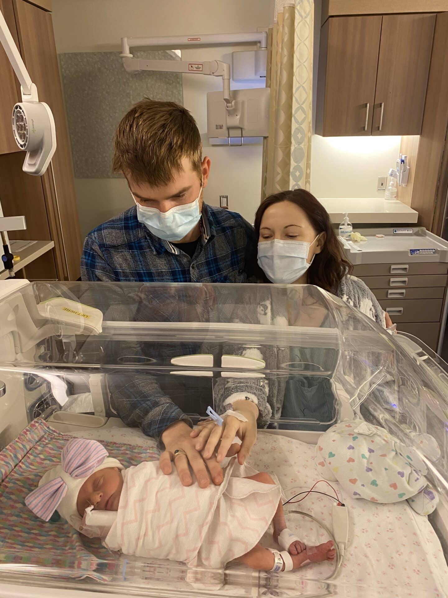Jenn Schappert with her husband and one of their twins