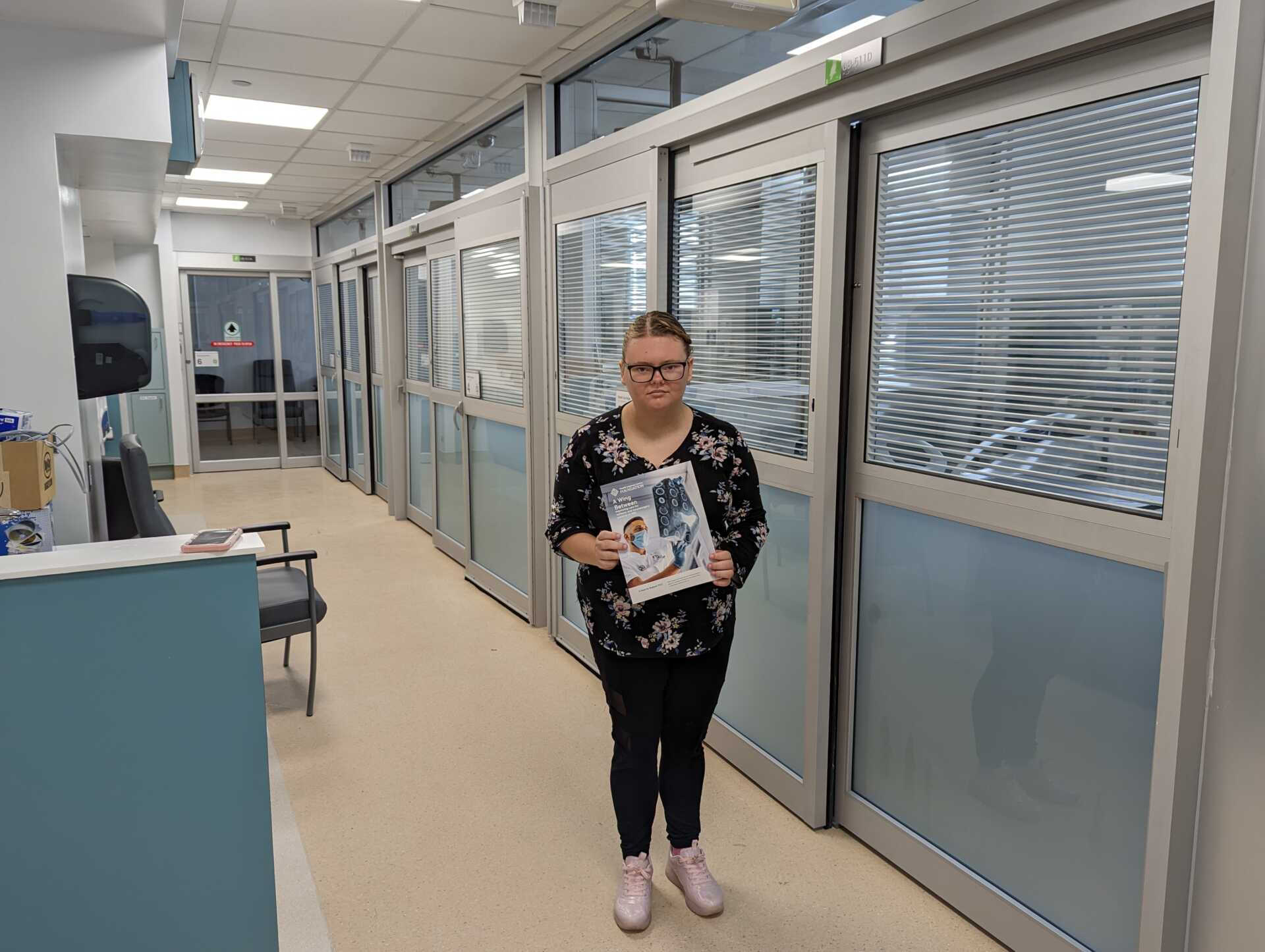 Izabella Deise, standing outside of the newly renovated, four private rooms that will comprise Unit B5B